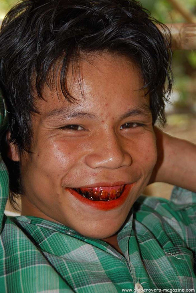 Portaits - boy with red betel nut mount in Village of Kinmun, MYANMAR