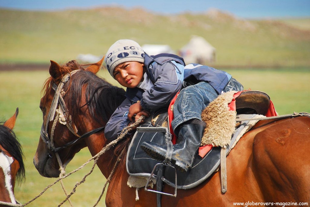 This little guy knows his horse so well. Kids are on their horses from a very young age. Just like many other kids in developed countries are on their PlayStations from a very early stage. Song kul Lake, Kyrgyzstan