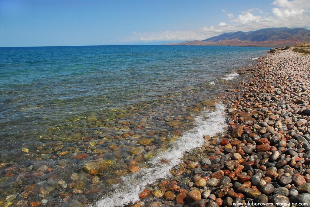 The crystal clear waters on the south side of Yssy-Kul lake at the Bel-Tam yurts near Bokonbaeva, Kyrgyzstan