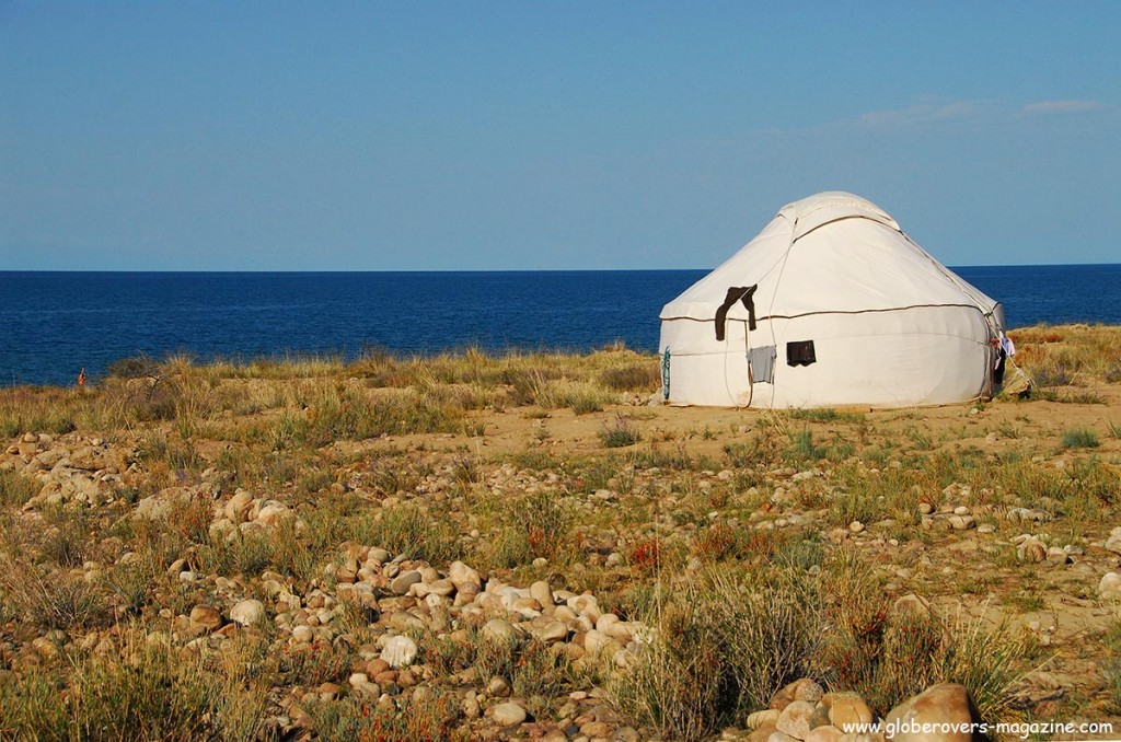 The crystal clear waters on the south side of Yssy-Kul lake at the Bel-Tam yurts near Bokonbaeva, Kyrgyzstan